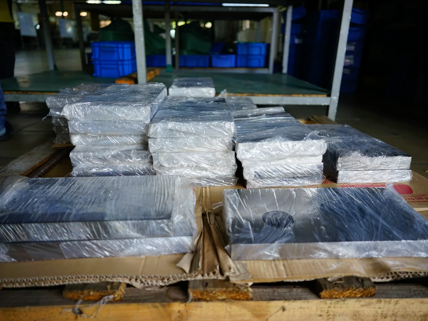Machined parts stretch-wrapped and labelled on a pallet ready for export from Vietnam