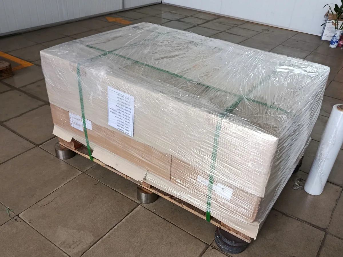 Machined parts wrapped and strapped on a pallet ready for export from Vietnam