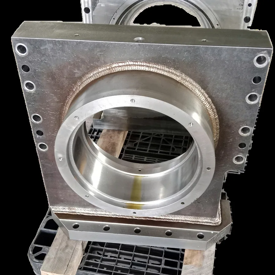 Fabricated sheet metal enclosure with machined mounting faces